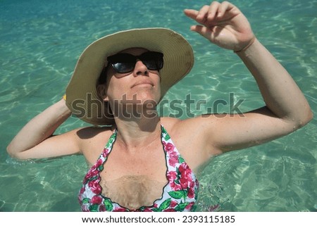 woman enjoing holidays in a turquoise water beach in mallorca