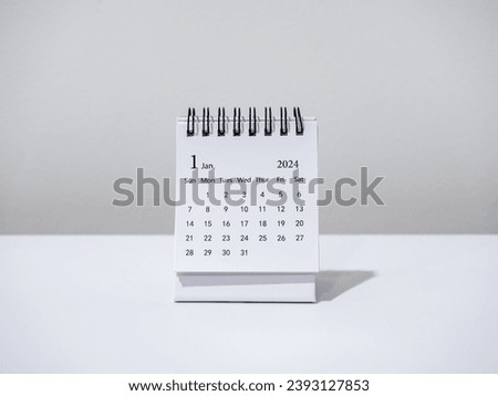 A January 2024 calendar desk for the organizer to plan and reminder isolated on white background, minimal style. White small table calendar with the page of the first month, Happy new year 2024. Royalty-Free Stock Photo #2393127853