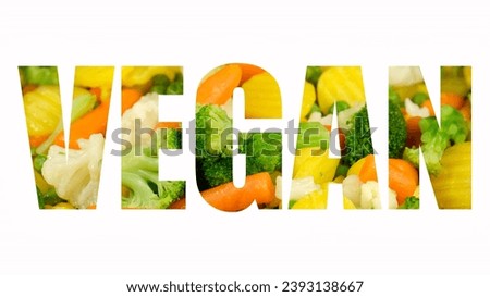 A sign Vegan on white background. Colorful vegetables stirring and frying on a pan in word - Vegan