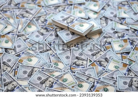 Very big amount of US hundred dollar bills close up. Huge quantity of united states currency notes on flat table