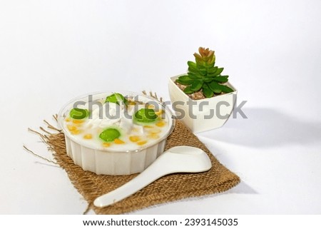 Dessert of Thailand with coconut jelly put on sack in white background. Isolated picture.
