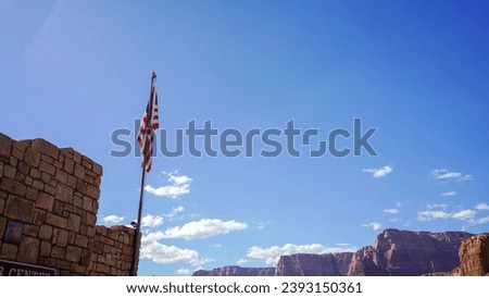 Views of the Navajo bridge on a clear day with the Colorado river below and condors on the bridge Royalty-Free Stock Photo #2393150361