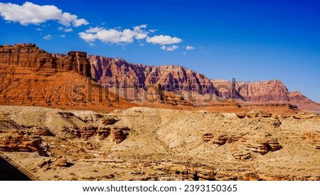Views of the Navajo bridge on a clear day with the Colorado river below and condors on the bridge Royalty-Free Stock Photo #2393150365