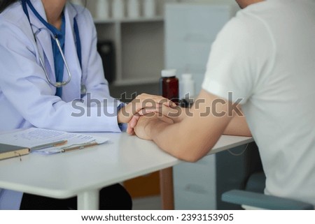 Doctor talking with patient in hospital, The doctor is explaining information about various diseases and treatment methods in detail for the patient to understand before treatment. Royalty-Free Stock Photo #2393153905