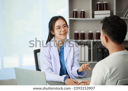 Doctor talking with patient in hospital, The doctor is explaining information about various diseases and treatment methods in detail for the patient to understand before treatment. Royalty-Free Stock Photo #2393153907