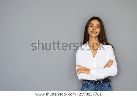 Smiling business woman with crossed arms. Confident successful girl.