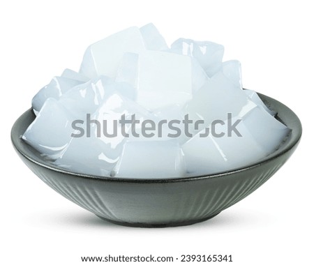 Nata de coco or coconut gel in a black bowl isolated on white background Royalty-Free Stock Photo #2393165341