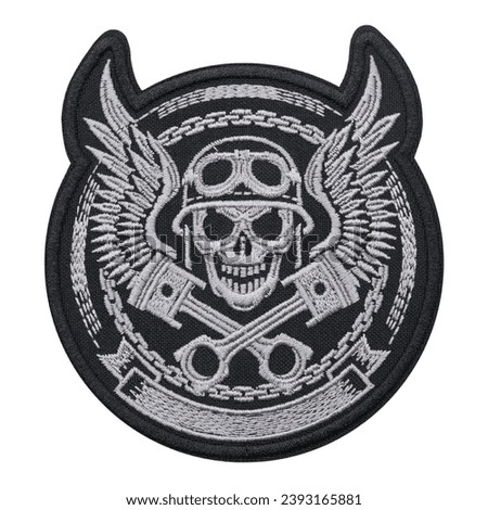Embroidered patch Skull of a biker in helmet and with wings. Engine pistons Ride. Accessory for rockers, metalheads, punks, goths.