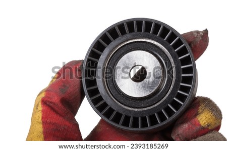 V-belt tensioner for attachments of an internal combustion engine of a car. Used auto parts catalog Royalty-Free Stock Photo #2393185269