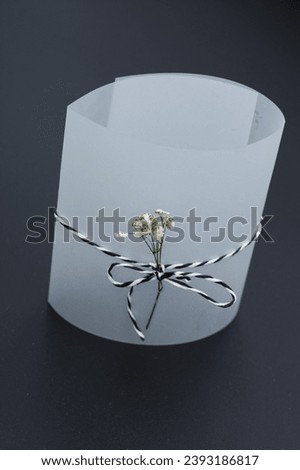 support with flower for wedding invitation