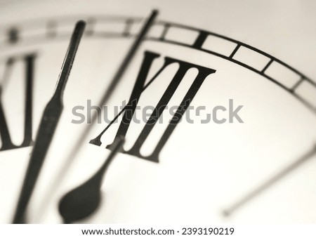 macro of román numerals clock at 12am 12pm Royalty-Free Stock Photo #2393190219