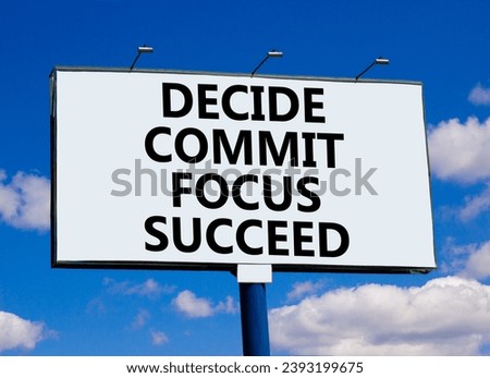 Decide commit focus succeed symbol. Concept word Decide Commit Focus Succeed on beautiful big billboard. Beautiful blue sky cloud background. Business decide commit focus succeed concept. Copy space. Royalty-Free Stock Photo #2393199675
