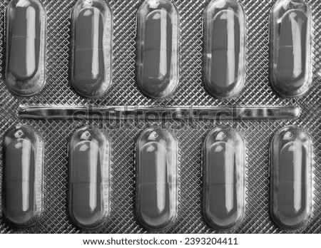 ten useful yellow pills against pain closeup Royalty-Free Stock Photo #2393204411