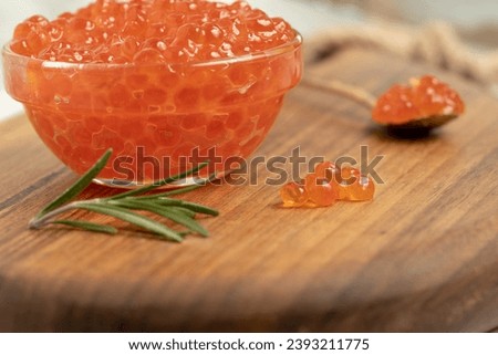red caviar on the table with greens. High quality photo