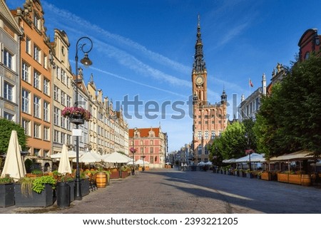 Gdansk Town Hall located on Dluga street (Long lane) in old town. A walk through the city on a sunny summer day. Gdansk, Poland Royalty-Free Stock Photo #2393221205