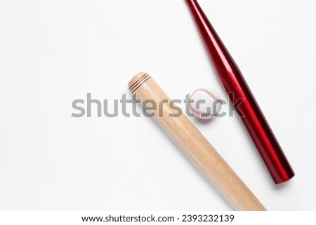 Baseball bats and ball on white background, flat lay. Space for text