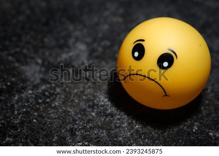 Yellow emoticon with face expression on a dictionary book, sad , happy and proud learning concept