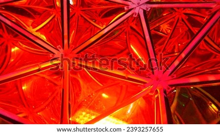 Manufacture of artistic stained glass windows of all colors, in light, urban context, magical beauty photographed and in color, light reflection, close-up of colored glass, metal junction 