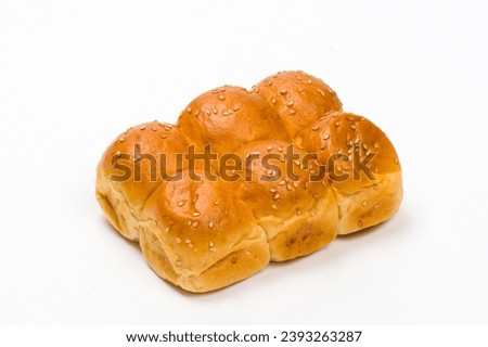 Close-up image of six freshly baked burger buns,  isolated on white background