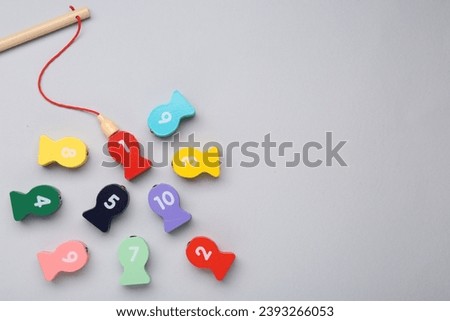 Educational game Fishing for Numbers on light grey background, flat lay. Space for text