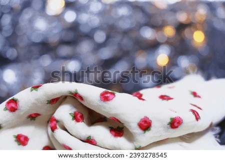 Ukrainian folk scarf on an abstract background, folk traditions, Christmas greetings, holiday.silver bokeh for New Year's Eve, reflection, Christmas, New Year's