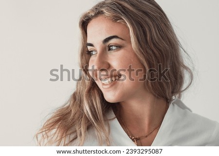 Happy young woman look in distance feeling positive and optimistic, dream or visualizing of new beginning, smiling millennial girl thinking overjoyed excited for future, happiness, good mood concept