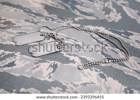 US AIR FORCE digital tiger-stripe pattern Airman Battle Uniform with dog tags background