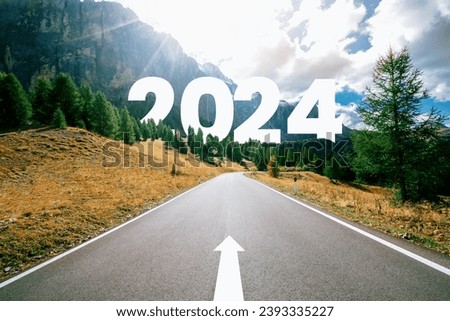 2024 New Year road trip travel and future vision concept . Nature landscape with highway road leading forward to happy new year celebration in the beginning of 2024 for bliss and successful start . Royalty-Free Stock Photo #2393335227
