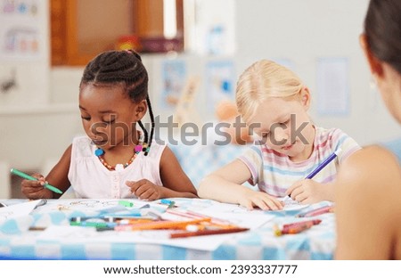 Children, pencil and drawing for homework in classroom with creative, art or project for picture. Little girl, friend and diversity with serious look for learning, education and decision for coloring