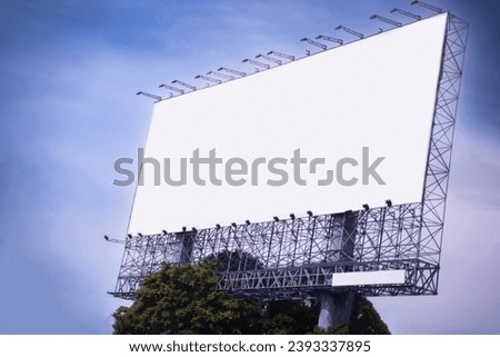 Large blank outdoor billboard with sky background.