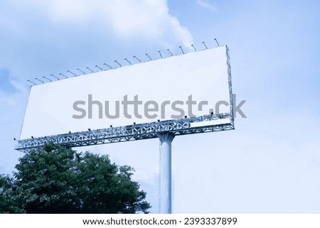 Large blank outdoor billboard with sky background.