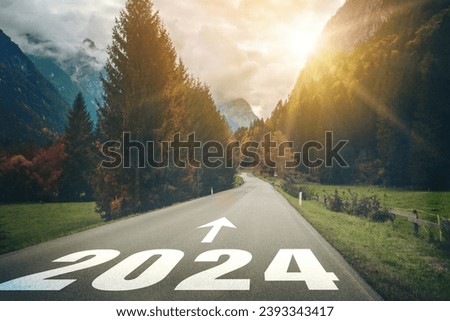 2024 New Year road trip travel and future vision concept . Nature landscape with highway road leading forward to happy new year celebration in the beginning of 2024 for bliss and successful start . Royalty-Free Stock Photo #2393343417