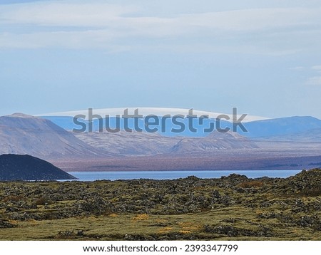 Iceland's surreal beauty captured in an image: a stunning panorama of otherworldly landscapes. Majestic waterfalls cascade, glaciers gleam, and geothermal wonders paint a picture of raw.