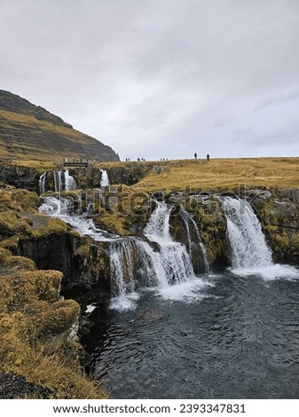 Iceland's surreal beauty captured in an image: a stunning panorama of otherworldly landscapes. Majestic waterfalls cascade, glaciers gleam, and geothermal wonders paint a picture of raw.