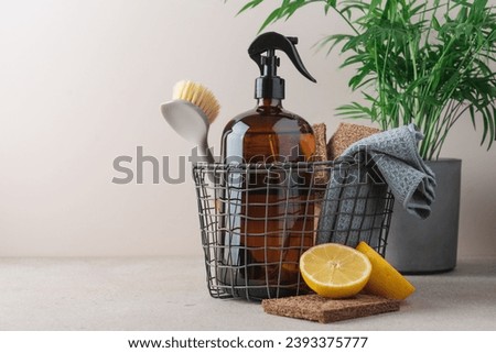 Zero waste cleaning supplies basket with spray glass bottle. Concept of natural cleaning products Royalty-Free Stock Photo #2393375777