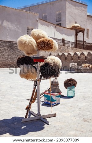 Uzbek traditional clothes such as skullcaps and fur hats and other colorful souvenirs, Tashkent, Uzbekistan.  Royalty-Free Stock Photo #2393377309