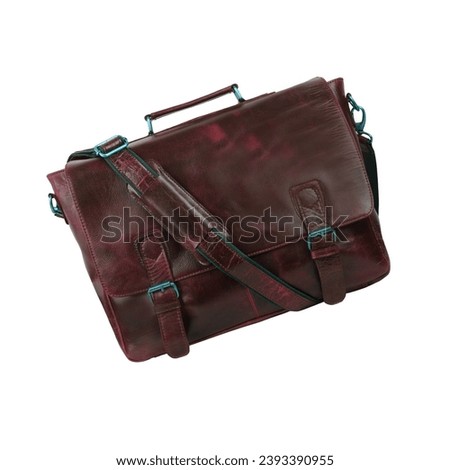 Brown leather briefcase bag, postman style. Handmade brown reddish bag with strap to hang on the shoulder or hold the object with the hand. Suitcase, haversack or satchel, isolated on white background Royalty-Free Stock Photo #2393390955
