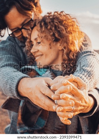 Romance and love people in outdoors. Man and woman with hands together enjoy relationship and leisure activity. Country side beautiful estination travel in background. Happy couple smile and love Royalty-Free Stock Photo #2393399471