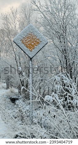 snow covers traffic signs road side 