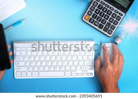 businessman working on computer with idea innovation and inspiration concept illuminated light bulb on table creative new idea innovation brainstorming inspiration and solution concepts