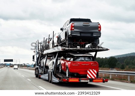 How to Deal with a Car Breakdown on the Road. A Tow Truck Service Helping a Vehicle with Damage. Emergency Roadside Assistance on the Highway After a Collision. Royalty-Free Stock Photo #2393412329