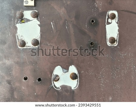 White painted old rusted door lock with handle removed closeup
