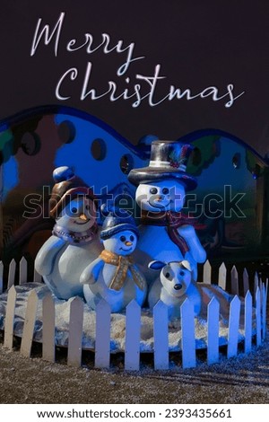 Merry Christmas with Snowman. Christmas decoration with snowman and snowman on a blue background. Merry Christmas and Happy New Year