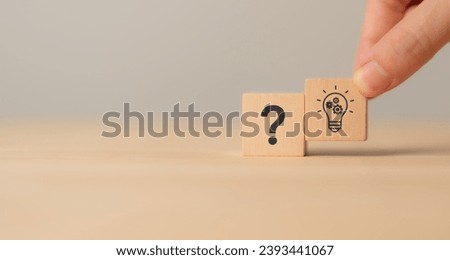 Question marks and light bulb symbolizing idea or solution. Problem solving skill, creativity, innovation, brainstorming, critical thinking and root cause analysis concept. Question, idea and answer. Royalty-Free Stock Photo #2393441067