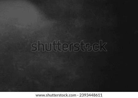Dark black background. Grunge wallpaper. Chalkboard for white text. Worn surface