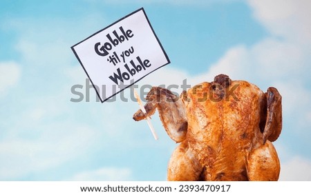 Cooked turkey holding a sign