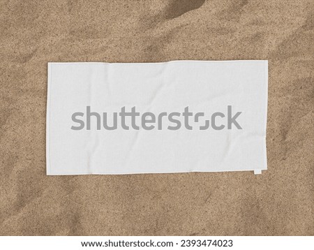 Rectangular Beach Towel in the sand Royalty-Free Stock Photo #2393474023
