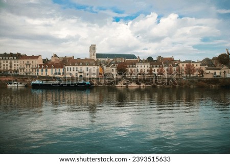 view of the town of Châlon-sur-saône along the Saône river in Saône-et-Loire in France