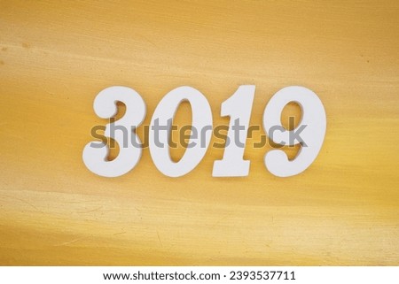 The golden yellow painted wood panel for the background, number 3019, is made from white painted wood.