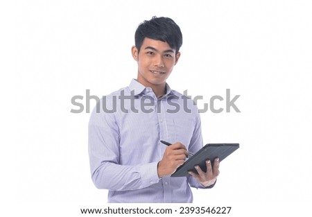 portrait of young businessman in striped shirt using tablet, with pin standing posing white background Royalty-Free Stock Photo #2393546227